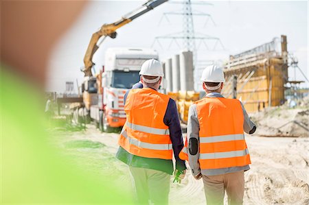 sicherheitsvorkehrung - Rear view of supervisors walking at construction site Stockbilder - Premium RF Lizenzfrei, Bildnummer: 693-08127804