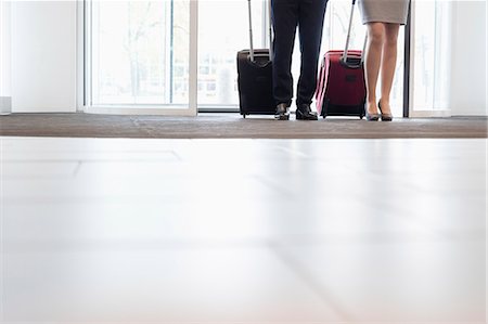 Low section of business people standing at doorway in convention center Stock Photo - Premium Royalty-Free, Code: 693-08769388