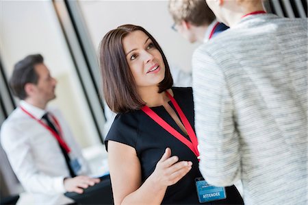 simsearch:693-08769401,k - Businesswomen talking during coffee break at convention center Stock Photo - Premium Royalty-Free, Code: 693-08769403