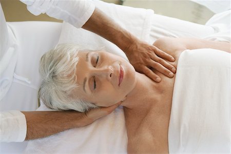 senior and spa - Woman Receiving a Massage, head and shoulders Stock Photo - Premium Royalty-Free, Code: 693-03299984