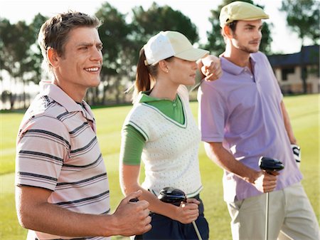 simsearch:693-03304456,k - Three young golfers on court Foto de stock - Sin royalties Premium, Código: 693-03304455