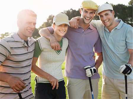 simsearch:693-06668077,k - Group of young golfers posing on court, portrait Fotografie stock - Premium Royalty-Free, Codice: 693-03304456