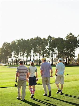 Quatre jeunes golfeurs marchant sur cours, vue arrière Photographie de stock - Premium Libres de Droits, Code: 693-03304460