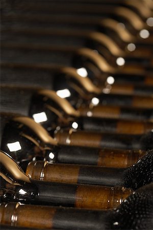 Wine bottles lying down in order Stock Photo - Premium Royalty-Free, Code: 693-03304562