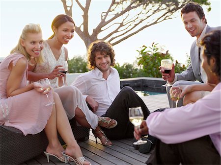 friends porch - Friends sitting on porch Drinking and socialising Stock Photo - Premium Royalty-Free, Code: 693-03304930