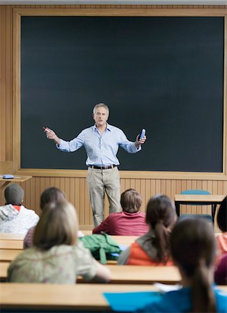 professor at chalkboard - Professor giving a lecture Stock Photo - Premium Royalty-Free, Code: 693-03305205