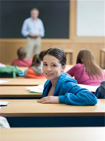 smart poses of teenager girl - Student in lecture room, portrait Stock Photo - Premium Royalty-Free, Code: 693-03305207
