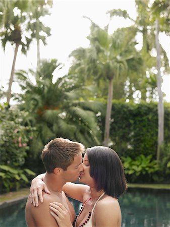 simsearch:693-03564644,k - Young Couple Kissing in Garden Stock Photo - Premium Royalty-Free, Code: 693-03305562