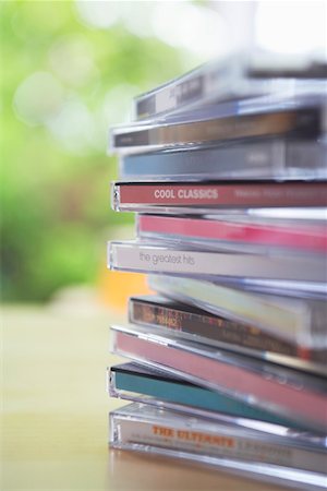 Pile of CD jewel cases on table, close-up Stock Photo - Premium Royalty-Free, Code: 693-03306005