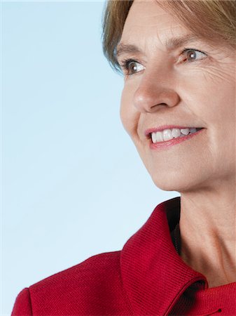 simsearch:693-03305464,k - Middle-aged woman looking away and smiling, close-up Stock Photo - Premium Royalty-Free, Code: 693-03306700