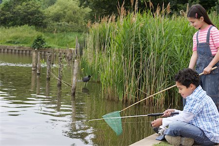simsearch:693-03314791,k - Brother and sister (5-9) fishing in river Stock Photo - Premium Royalty-Free, Code: 693-03306945