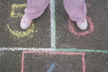 Girl (7-9) playing hop-scotch in school playground, low section Stock Photo - Premium Royalty-Free, Code: 693-03307006