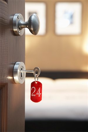 door number - Key in hotel room's door Stock Photo - Premium Royalty-Free, Code: 693-03307070