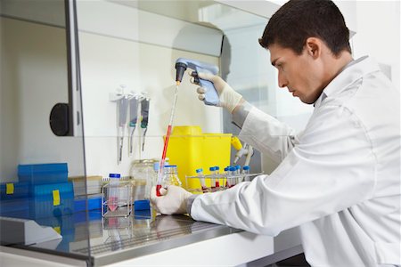 eyedropper - Scientist filling test tube with pipette in laboratory Stock Photo - Premium Royalty-Free, Code: 693-03308023