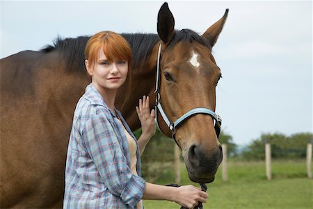 Woman with horse in field, portrait Stock Photo - Premium Royalty-Free, Code: 693-03308405