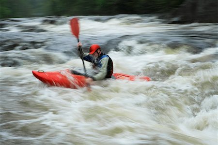 simsearch:400-04536316,k - Man kayaking in river Foto de stock - Sin royalties Premium, Código: 693-03308497