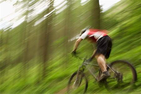 Male cyclist on track in countryside Stock Photo - Premium Royalty-Free, Code: 693-03308595