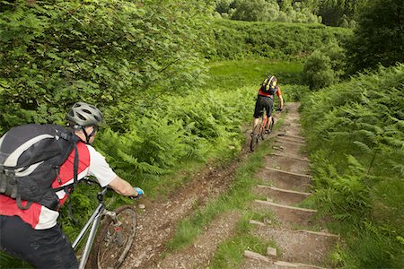 pictures of the cyclist track - Two cyclists on track in countryside Stock Photo - Premium Royalty-Free, Code: 693-03308590