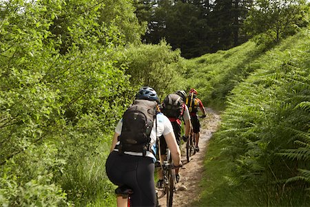 pictures of the cyclist track - Three cyclists on track in countryside Stock Photo - Premium Royalty-Free, Code: 693-03308592