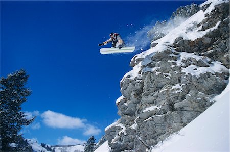 rock jump - Person on snowboard, jumping, low angle view Stock Photo - Premium Royalty-Free, Code: 693-03308673