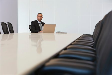 simsearch:693-03565397,k - Business man using laptop in board room Stock Photo - Premium Royalty-Free, Code: 693-03308793