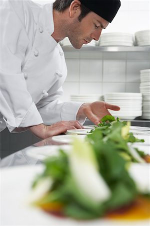 salad garnish - Male chef preparing salad in kitchen Stock Photo - Premium Royalty-Free, Code: 693-03308926