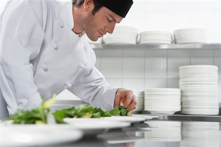 Male chef preparing salad in kitchen Stock Photo - Premium Royalty-Free, Code: 693-03308927