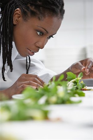 salad garnish - Female chef preparing salad in kitchen Stock Photo - Premium Royalty-Free, Code: 693-03308920