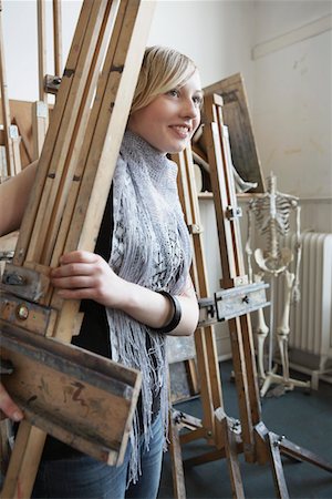 Art student carrying easel into studio Stock Photo - Premium Royalty-Free, Code: 693-03309455