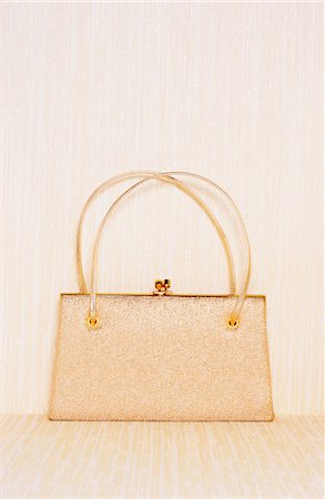 Gold purse Stock Photo - Premium Royalty-Free, Code: 693-03309527