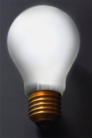 Light bulb on black background, close-up Stock Photo - Premium Royalty-Free, Code: 693-03309538