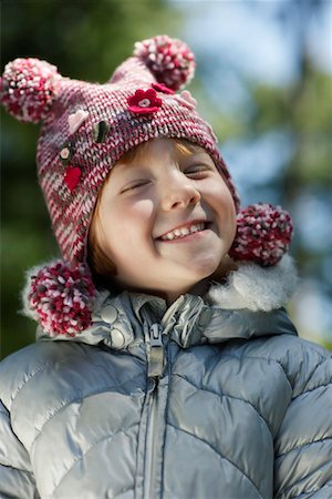 Portrait of girl (5-6) in winter clothes, smiling Stock Photo - Premium Royalty-Free, Code: 693-03309807