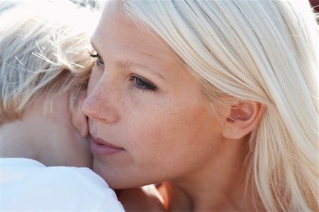 Young mother and son (3-4), close-up, focus on mother's face Stock Photo - Premium Royalty-Free, Code: 693-03309850
