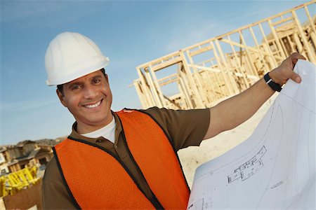 simsearch:693-06018719,k - Construction Worker Reading Blueprints Stock Photo - Premium Royalty-Free, Code: 693-03300010