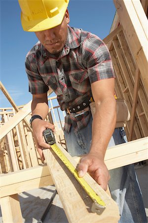 simsearch:693-06018719,k - Construction Worker Measuring Timber Stock Photo - Premium Royalty-Free, Code: 693-03300012