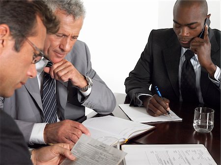 simsearch:693-03707355,k - Three businessmen in conference meeting Stock Photo - Premium Royalty-Free, Code: 693-03300262