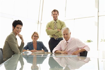 Four Businesspeople in Meeting Stock Photo - Premium Royalty-Free, Code: 693-03300317