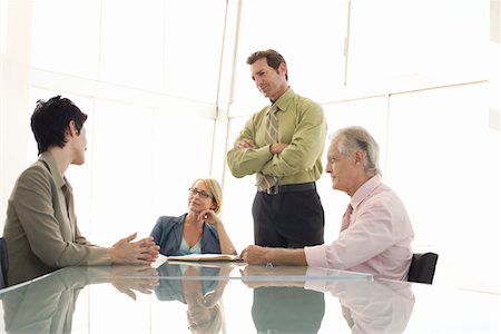 simsearch:693-03707355,k - Business colleagues working in conference room Stock Photo - Premium Royalty-Free, Code: 693-03300331