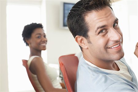 Businessman in office meeting, portrait Stock Photo - Premium Royalty-Free, Code: 693-03300349