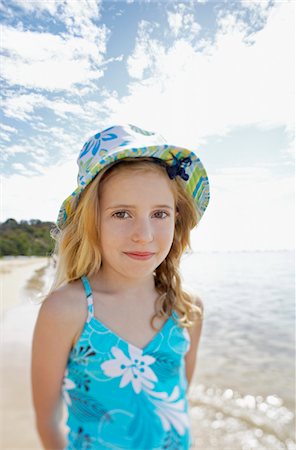 preteen one piece swimsuit - Girl standing on beach, portrait Stock Photo - Premium Royalty-Free, Code: 693-03300547