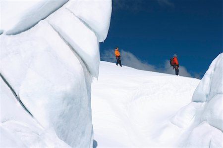 simsearch:693-03300957,k - Mountain climbers walking past ice formation Foto de stock - Sin royalties Premium, Código: 693-03300970