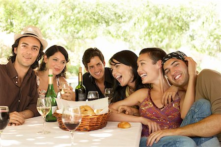 Group of young people at table outdoors, portrait. Stock Photo - Premium Royalty-Free, Code: 693-03301558