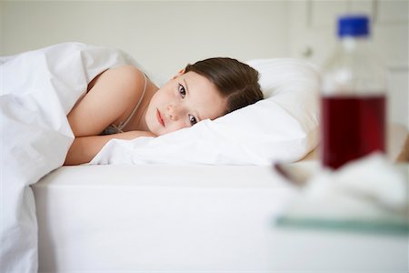 pill bottles girl - Little Girl in Bed with a Cold, portrait Stock Photo - Premium Royalty-Free, Code: 693-03301936