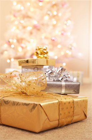 ribbon gold - Christmas gifts on floor Stock Photo - Premium Royalty-Free, Code: 693-03302143