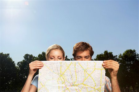 simsearch:693-03302155,k - Vacationing couple in park looking at large map Stock Photo - Premium Royalty-Free, Code: 693-03302156