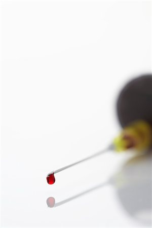 Blood droplet on syringe, close-up Stock Photo - Premium Royalty-Free, Code: 693-03302203