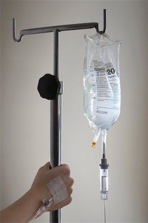 An IV bag hanging in a hospital room stock photo - OFFSET