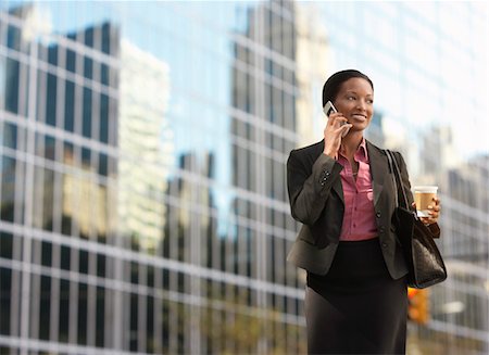 simsearch:693-03564532,k - Businesswoman using mobile phone outside office building Stock Photo - Premium Royalty-Free, Code: 693-03302403