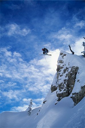 ski trail - Skier jumping from mountain ledge Stock Photo - Premium Royalty-Free, Code: 693-03302477