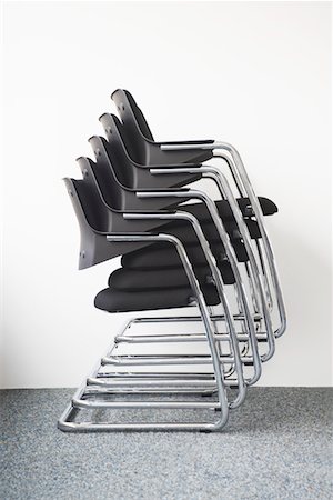 repeat sequence - Stack of office chairs against wall Stock Photo - Premium Royalty-Free, Code: 693-03302658